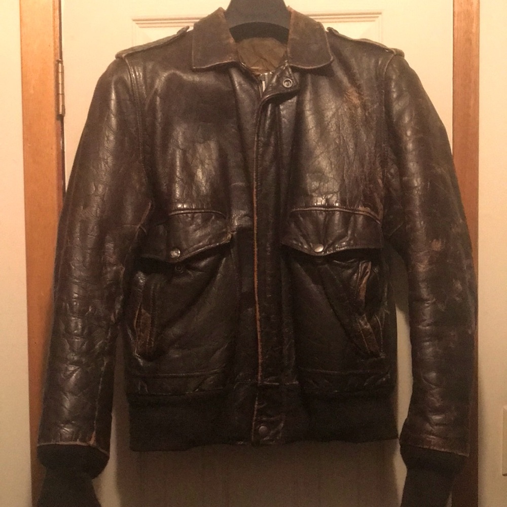 Get this “Top Gun” Leather Bomber jacket.  Fits like Men’s Small.